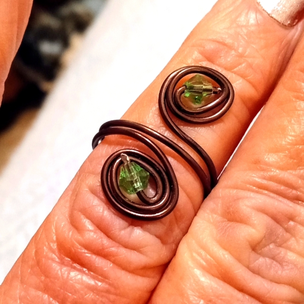 Handmade brown wire ring with green glass beads